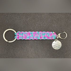 Neon Pink & Teal Paracord keychain with clip and charm.